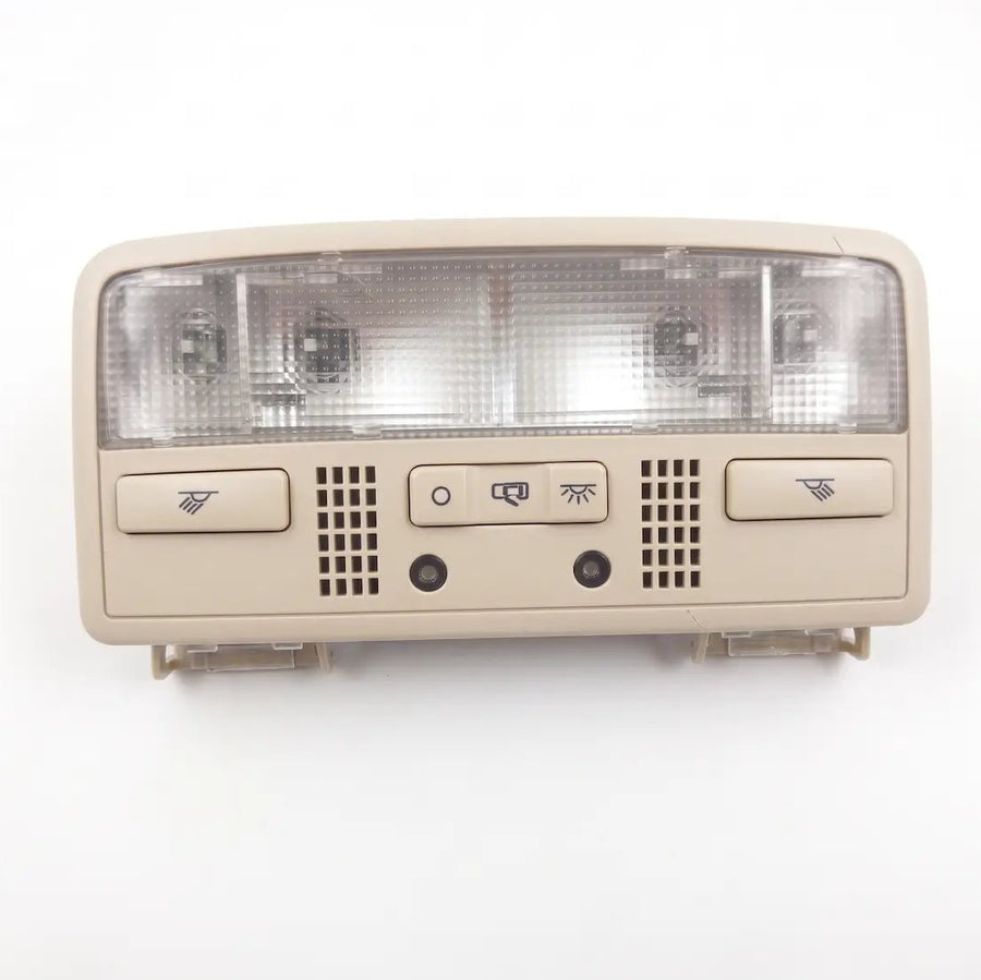 A beige passat w8 car overhead console light switch assembly with a clear textured lens, control buttons, and ventilation grilles, shown against a plain white background. Compatible with volkswagen polo vento ameo skoda rapid